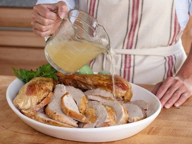 One of the best things you can do while you're cooking the day of Thanksgiving is have a pan of homemade turkey stock or storebought chicken stock on the back burner of your range — you can use it loosen up gravy, moisten sides, or, as foodnetwork.com suggests, revive overcooked turkey.