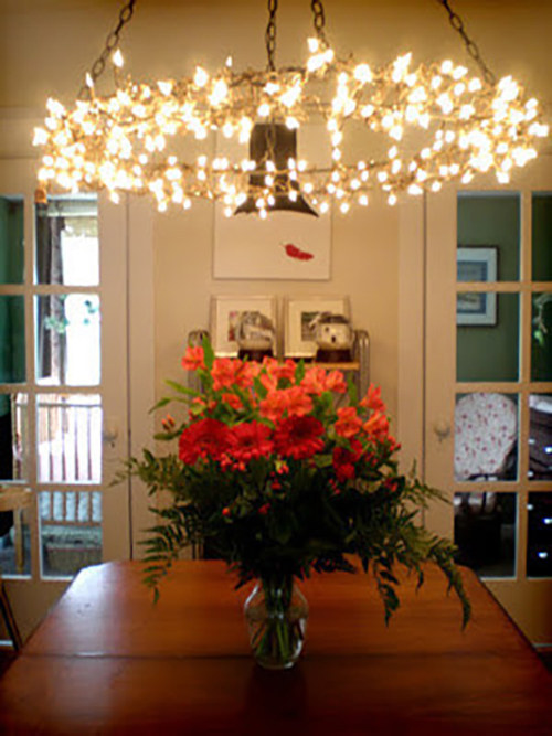 With just two wreath frames and the standard hardware used to hang overhead lights, you can add sparkle to any room. Check out Grosgrain to see how it's done.