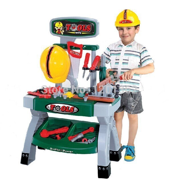 This kid knows that closed toe shoes and hard hats are the safest clothes for any home workshop.