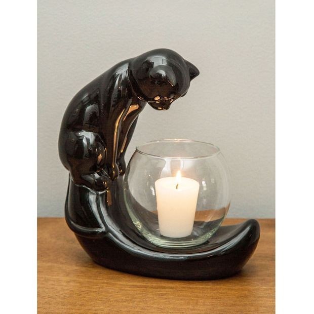 To protect your candle from your actual cat that'll hover over it anyway.