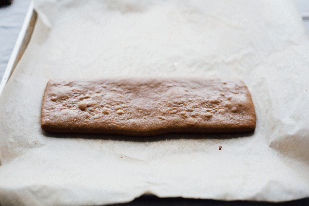Use parchment paper to wrap hot gingerbread around a can when it's fresh out of the oven. Hold the gingerbread there until it cools.