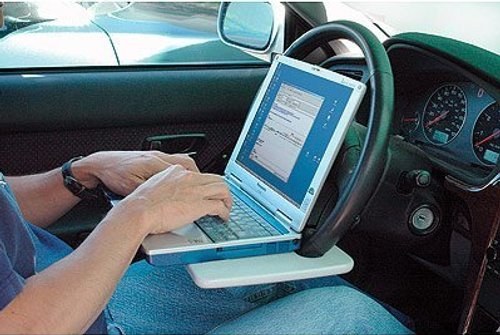 This thing attaches to your wheel so you can not only sit in your car to do work, but you can also keep a drink nearby because electricity and water is the new black and white. Oh, but wait! Not only do you get the steering wheel laptop desk, but you can spend a little extra and get the fold-away car slot specifically designed for storing wheel desks just in case you have no room to put a tray in your gigantic car.