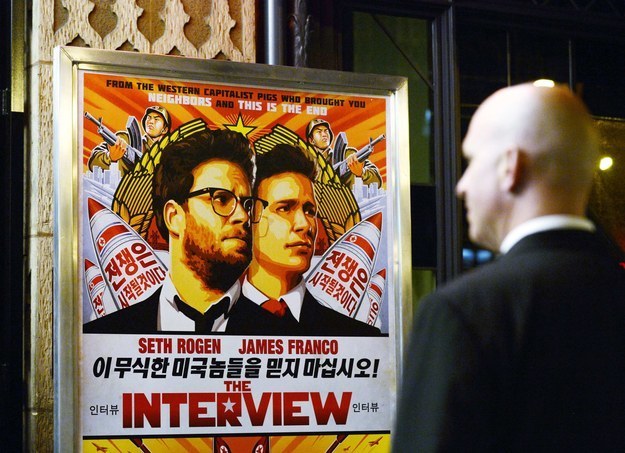 A security guard stands at the entrance of United Artists theater during the premiere of The Interview in Los Angeles on Dec. 11. The film has since been pulled.