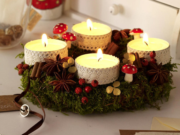 These Christmas décor makes one delightful piece for any table top. Dress up those tea light candles with some leftover white ribbons. Place them on top a small wreath to serve as holder. Add some red garnishments to color the greens.