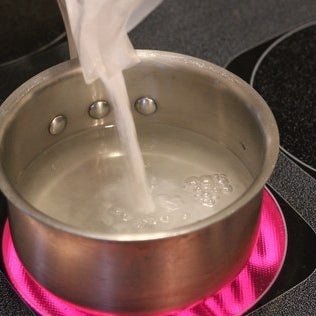Mix priming sugar with water