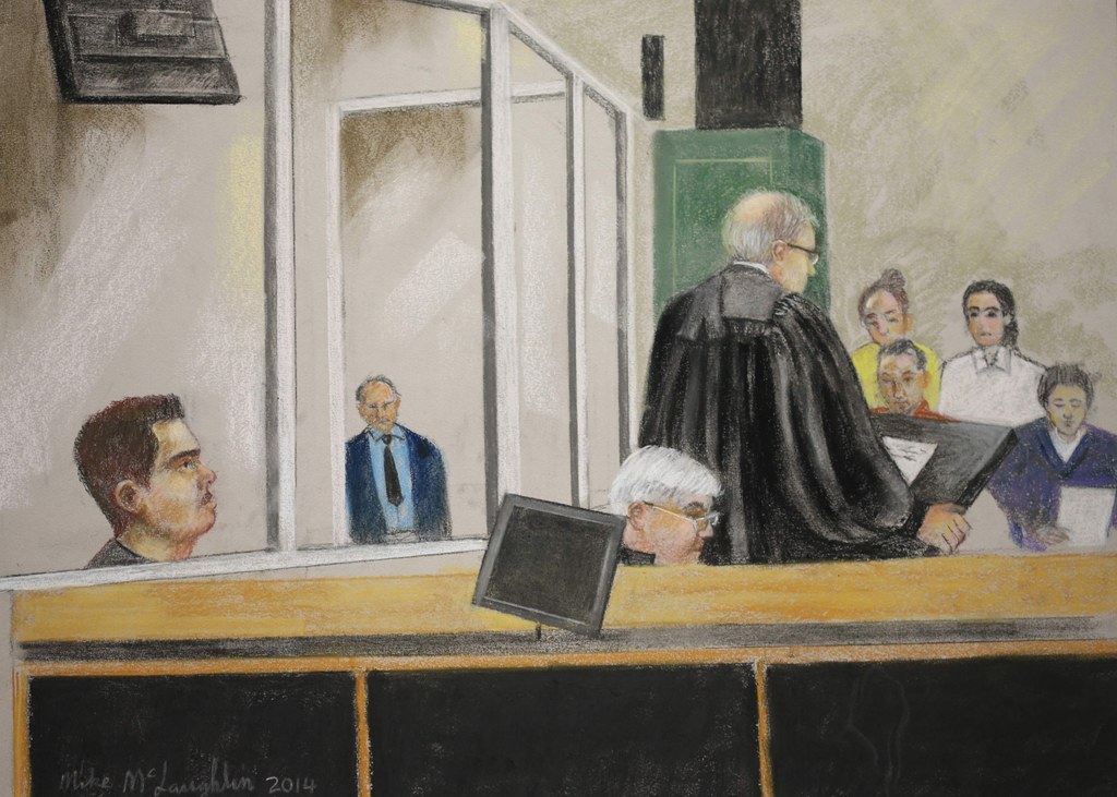 An artist's sketch shows Luka Rocco Magnotta (L) looking on as Crown prosecutor Louis Bouthillier gives his closing arguments to the jury during his trial in Montreal, December 11, 2014.