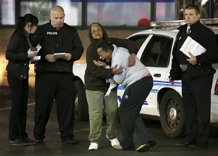 Antonio Martin's mother, Toni Martin, cries at the scene of the shooting early Wednesday.