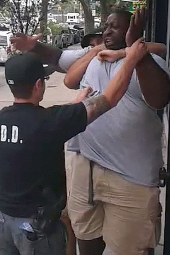 An image from the video showing NYPD officers tackling Garner before his death.