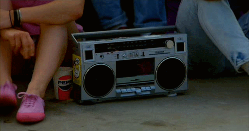 Like not even using headphone, but playing music on their iPhone loudly and perhaps singing/rapping along.