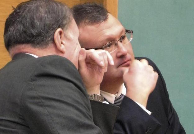 Then-Steubenville City Schools Superintendent Mike McVey, right, confers with his attorney Charles Bean during a court appearance.