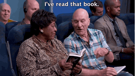 Reading is the universal symbol for "don't talk to me!"