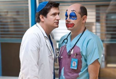 Please note this photo is not from Grey's as according to the internet this never happened. BUT IT DID! Ken played the manager of a restaurant where a disgruntled employee came in and shot up the place. Noticing a theme here Shonda... Anyway, Ken played a cocky jerk (surprise) who was then shot by that employee outside the hospital as well as Dr. Preston Burke! This resulted in Christina covering for Burke in surgeries until the tremors in his hand subsided.