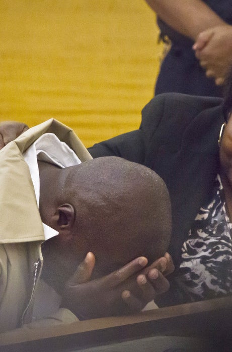 David McCallum weeps after his exoneration in October 2014 in New York. He was 16 when he was convicted of murder.