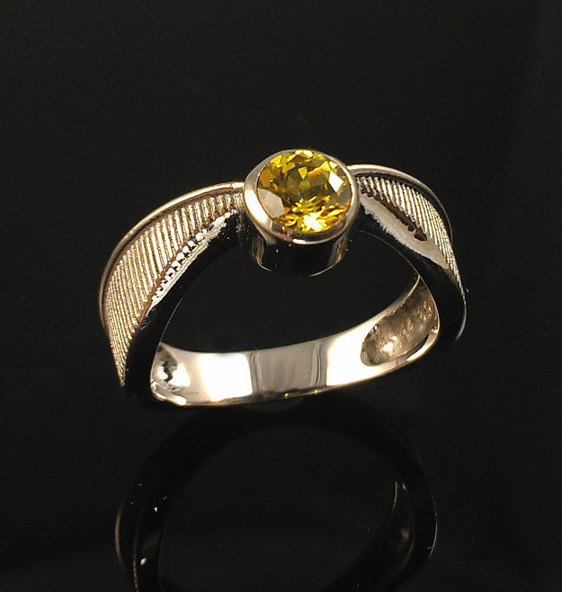 Snitch Ring in 18 Karat White Gold with Yellow Lab Sapphire, $1369.98Yup, this is the deluxe version of the Sterling Silver one talked about in the other Buzzfeed Article This “Harry Potter” Golden Snitch Engagement Ring Is Perfect.