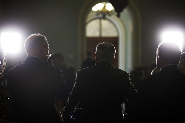 U.S. Senate Minority Leader Harry Reid (D-NV) (C) is flanked by Senator Charles Schumer (D-NY) (L) and Senator Dick Durbin (D-IL) (R)