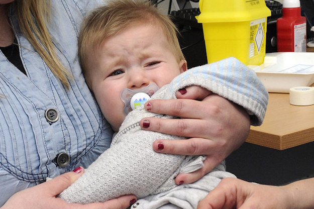 A baby is given an MMR injection.