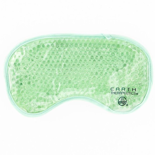 Green gel sleep mask that is frozen for soothing and cooling contact on skin
