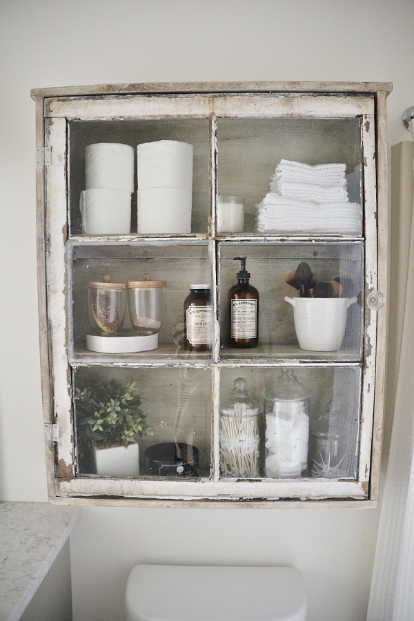 Turn a reclaimed window into a medicine cabinet.