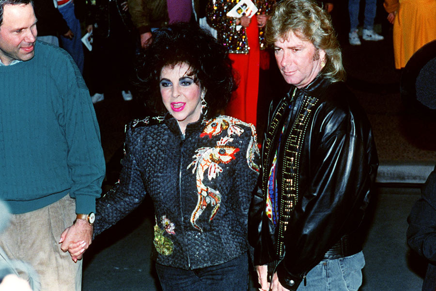 One night in February of 1992, Elizabeth Taylor arrived at Disneyland in a horse-drawn white carriage while one thousand of her closest friends lined the streets and cheered for her, thereby beginning the celebration of her 60th birthday. Guests like Jon Voight, Henry Winkler, Cheryl Tiegs, Gregory Peck, Tom Selleck, David Bowie, Richard Gere, Joni Mitchell, Dionne Warwick, Cindy Crawford, Geena Davis, Stevie Wonder and Shirley MacLaine were all there to mark the occasion, and everyone dined on pasta, turkey hot dogs, and other barbecued foods.Alcohol was served discretely, and guests were transported to Fantasyland via vintage automobiles decked out in orchids. Everyone was entertained by jugglers, folk dancers, a band and various Disney characters, and the pricetag of the event was kept very secretive (the only details revealed were that at the time, it cost $8,000 to rent the park after it has closed for the night).