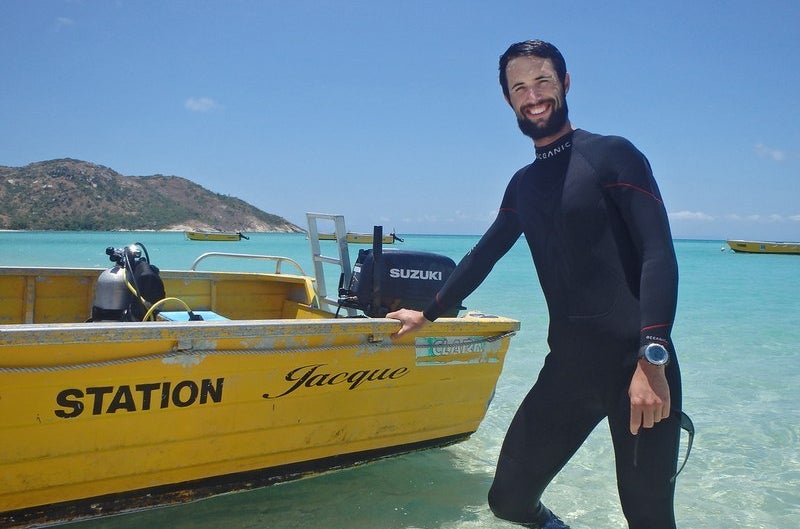 PhD student Jamie McWilliam preparing to deploy acoustic recorders at Lizard Island, Great Barrier Reef