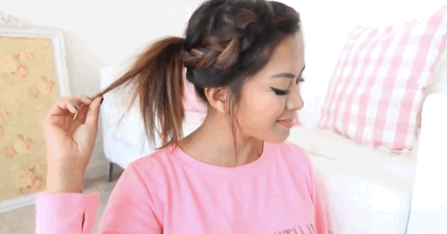 Braid one side of your hair, moving toward the back of your head. Secure hair in a ponytail. Backcomb the ponytail with a brush for added volume. Get the tutorial here.