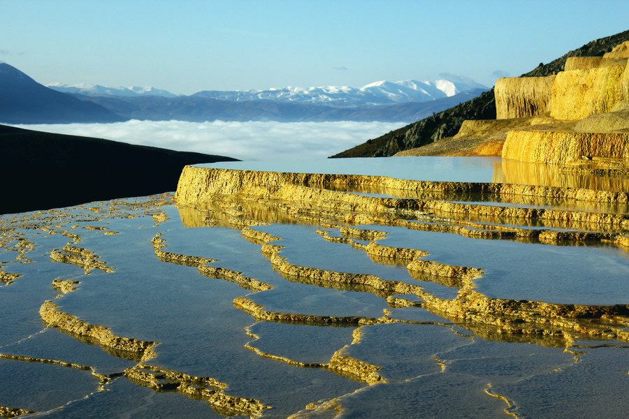 Badab Soort is a natural spring that's a result of thousands of years of flowing water. "Badab" in Farsi means gassed water, referring to the fact that the water in the spring is carbonated mineral water. Because of the saltiness of the water, it's considered to have medicinal properties and is used as a cure for rheumatism and other skin diseases and conditions. We've found the secret elixir of life, and it's been hiding in Iran.