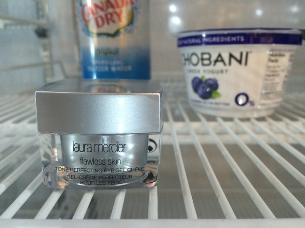 Tone reflecting eye cream placed in the refrigerator amongst everyday food items