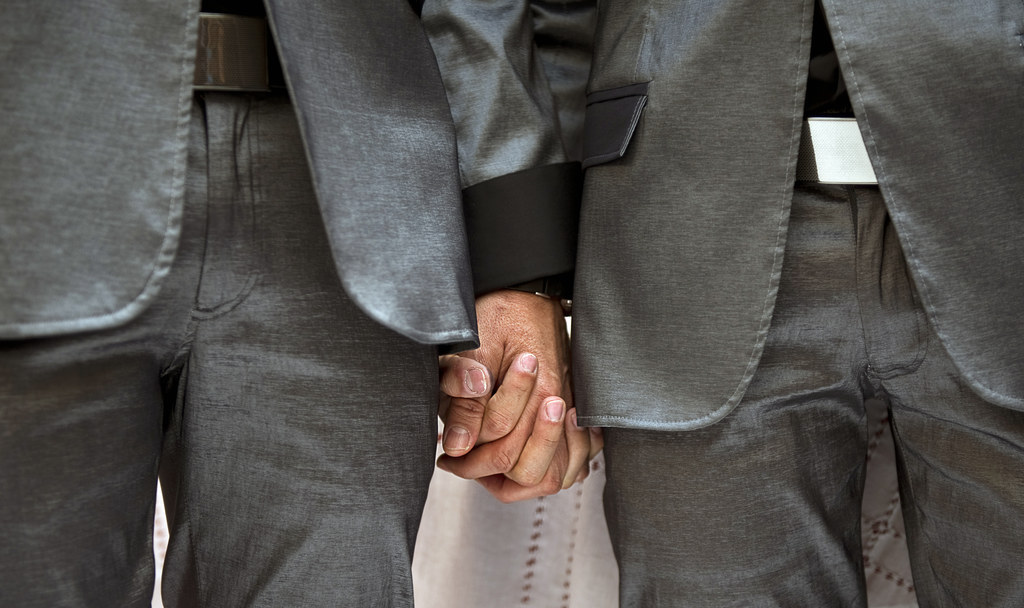 gay men in suits sexually examine men