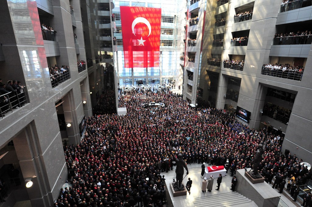 People stand in Istanbul near the coffin of senior Istanbul prosecutor Mehmet Selim Kiraz.