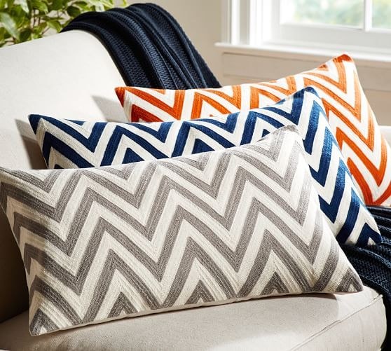 It seems gratuitous to have more than two pillows when you won’t be hosting a slew of people who actually care about your bed décor, but added pillows make your bed seem cozier, and are great back support when you’re up late writing papers in bed. Chevron throw pillows from Pottery Barn.