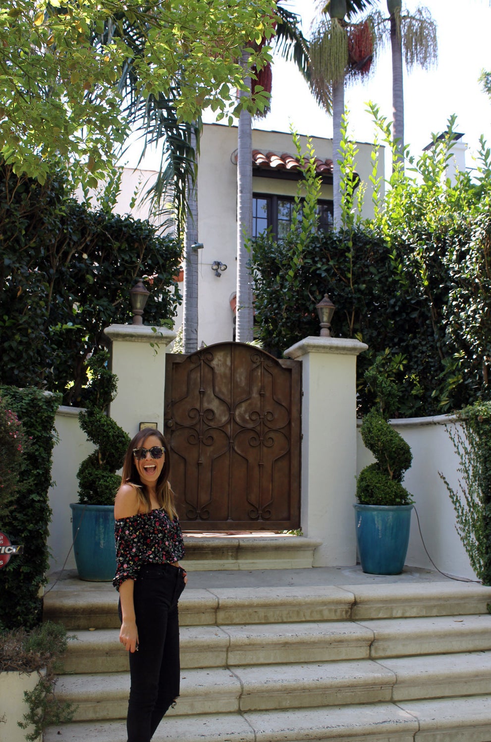 Lara standing outside the apartment.