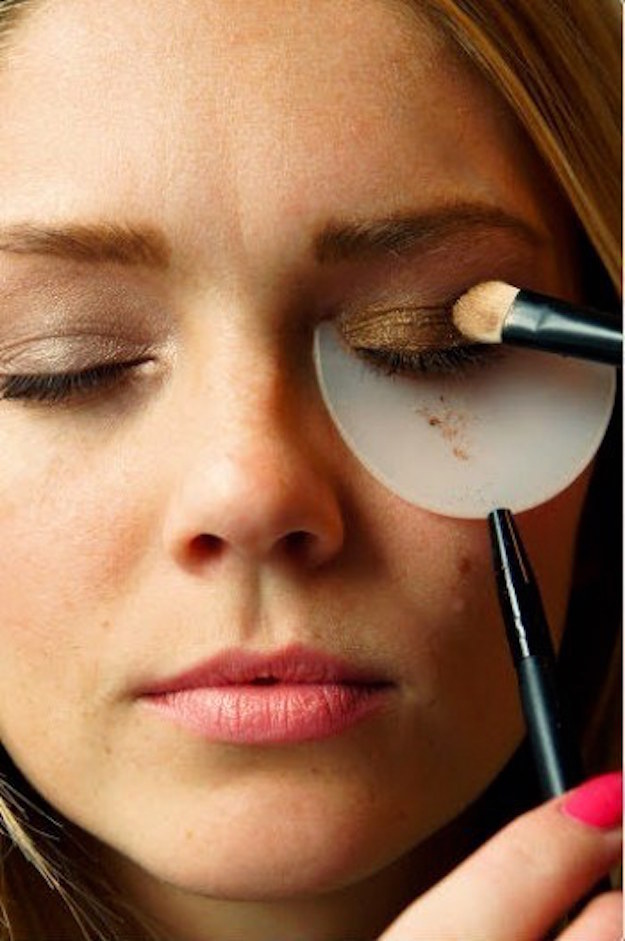 Or, pick up a shadow and mascara shield to hold under your eye as you apply.