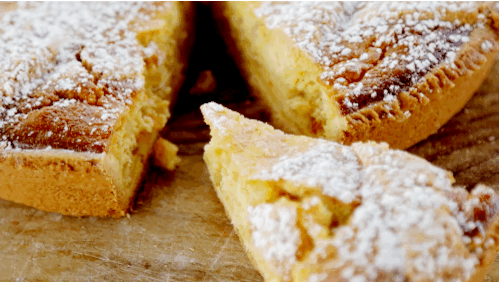 Filled with custard, and flavored with berries and candied orange peels.