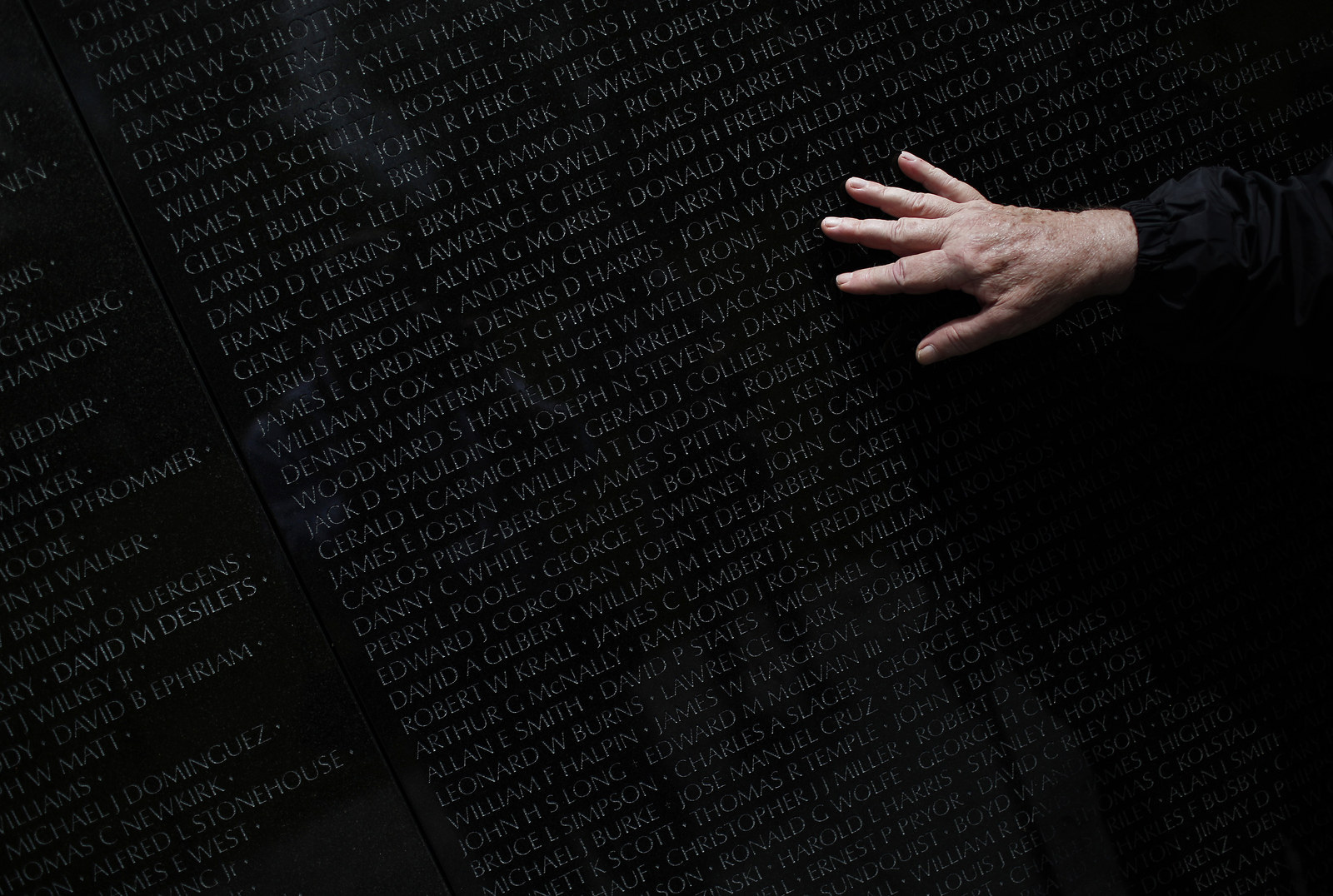 Vietnam war veteran Steve Moczary, who served two tours during the war, searches for the name of his friend Msgt. Cecil Hodgson at the Vietnam Veterans Memorial in Washington, DC. April 30 marks the day that the U.S. backed South Vietnamese government fell to North Vietnamese forces.