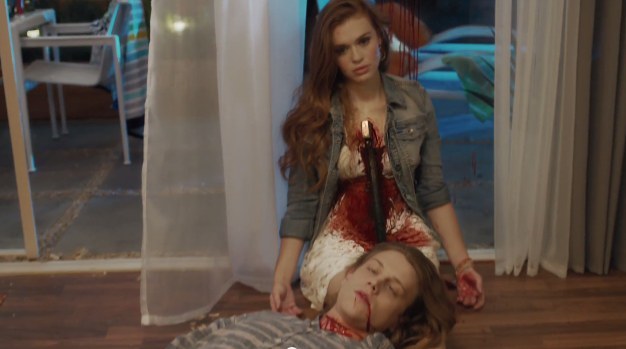 Holland Roden (Lydia) didn't have enough to worry about on "Teen Wolf" so why not chop her heart out with an axe and then lay a dead Alex Saxon (Max) from "Finding Carter" on her lap.