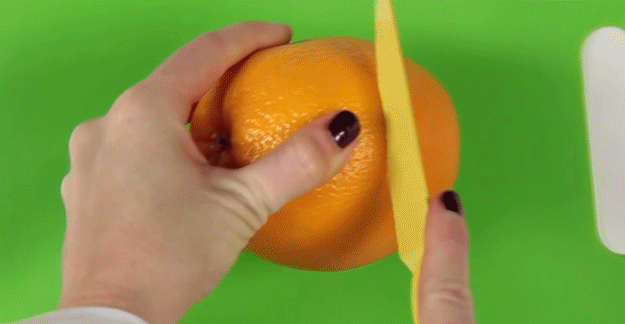 If you want your orange right this second, cut around its equator with a knife, making sure you go deep enough, then simply pull away the peel. Voila!