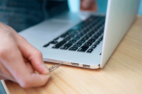 The nifty MiniDrive is the sneakiest way to increase MacBook storage, without paying for a new drive. It includes a 2 gigabyte microSD card — but you can use it with a microSD card of any size (they can hold as much as 256 GB). It slips in and out of the SD card slot built right into your 13- or 15-inch MacBook.