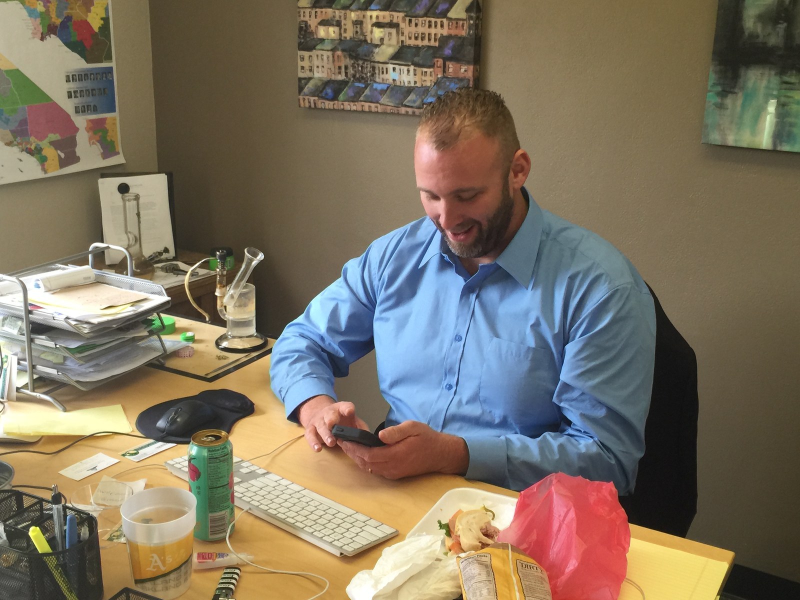 California Cannabis Industry Association Executive Director Nate Bradley keeps a bong and a hash oil rig at his desk.