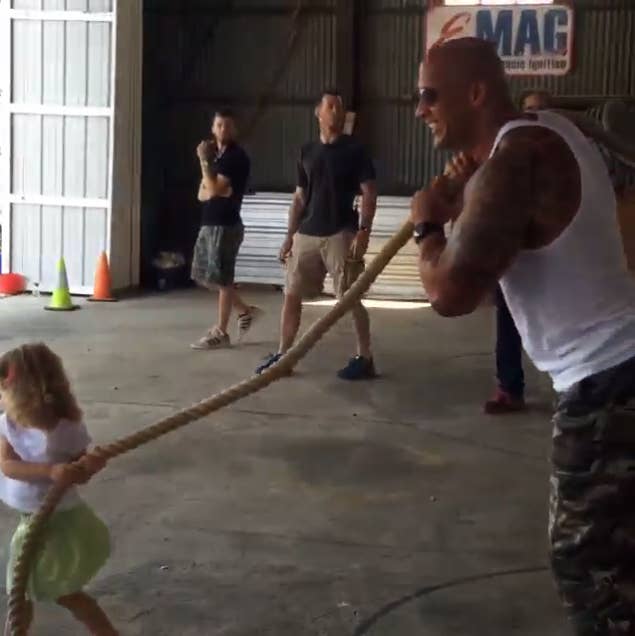Dwayne 'The Rock' Johnson helps a 2-year-old pull a plane: see the video