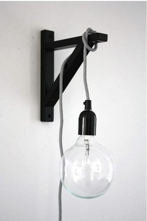 To avoid rewiring your entire place, you can also hang a corded lightbulb off of a wall-mounted shelf bracket.