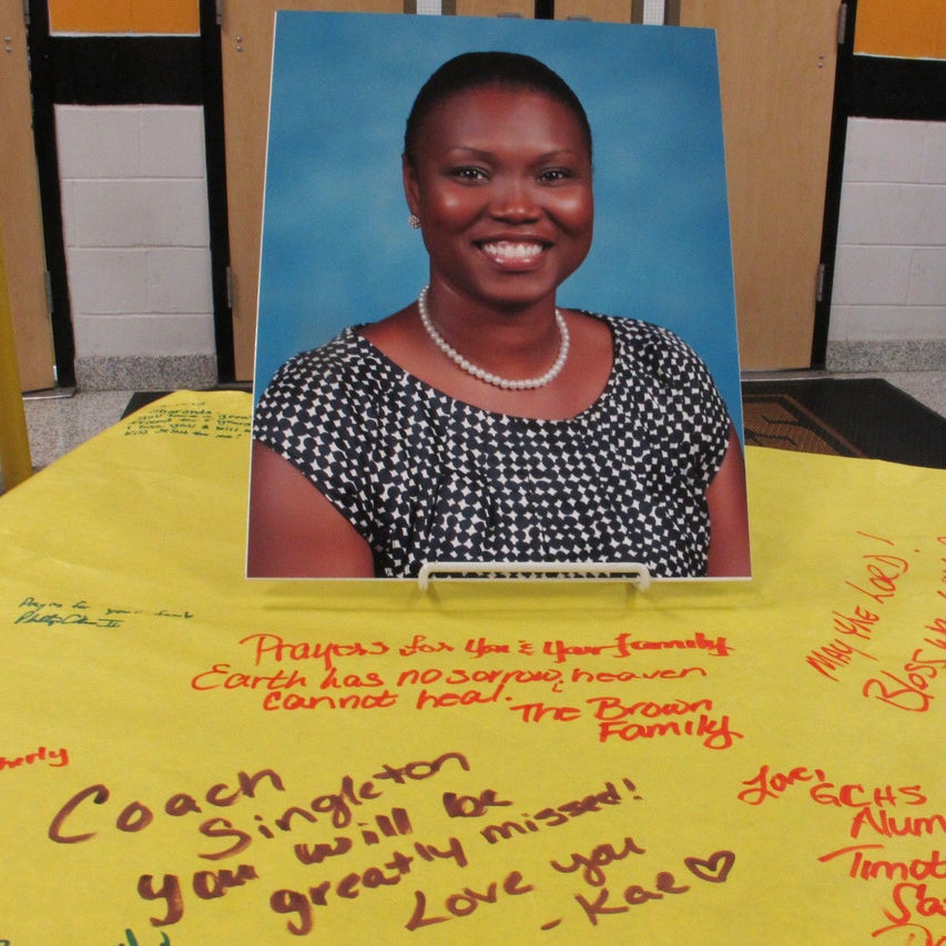 A picture of Sharonda Coleman-Singleton sits on a large paper signed by students, teachers and friends in Goose Creek .