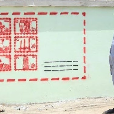 This reclaimed wall now displays a nostalgia-inducing Pakistani envelope with popular stamps.