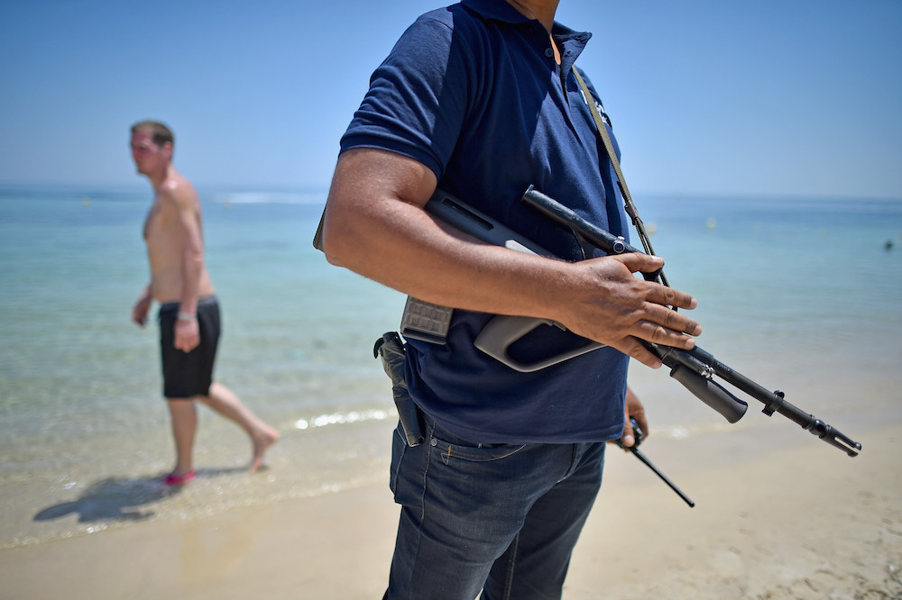 Armed police on patrol on Marhaba beach, where 38 people were killed on Friday in a terrorist attack.