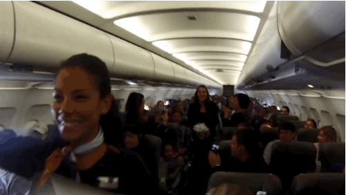 Flight attendant Chris hummed "The Wedding March" over the PA system.