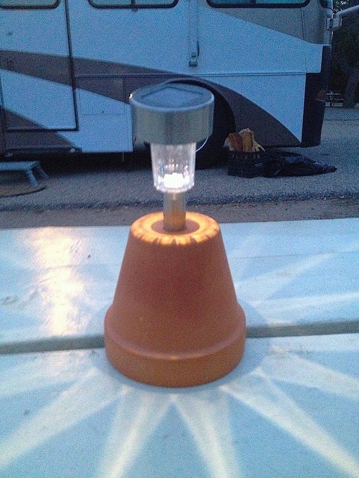 Solar Lights can often be inexpensive to purchase and there's no electricity required! Set them by the entrance of your tent or as a make-shift centerpiece during the day, and they will light your way at night.