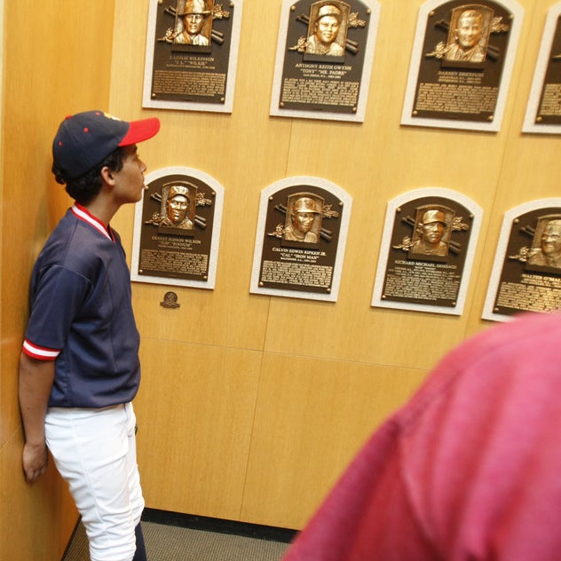 Jacob McCarthy view the Hall of Fame inductee player plaques at the National Baseball Hall of Fame.