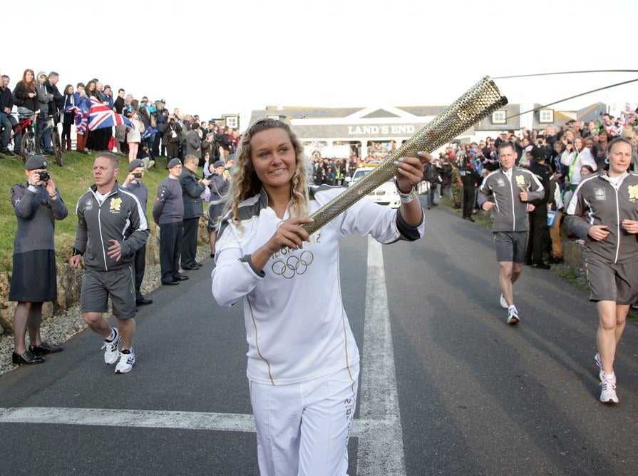 Anastassia (Tassy) Swallow carries the Olympic flame in 2012 on the leg between Land&#x27;s End and Sennon.
