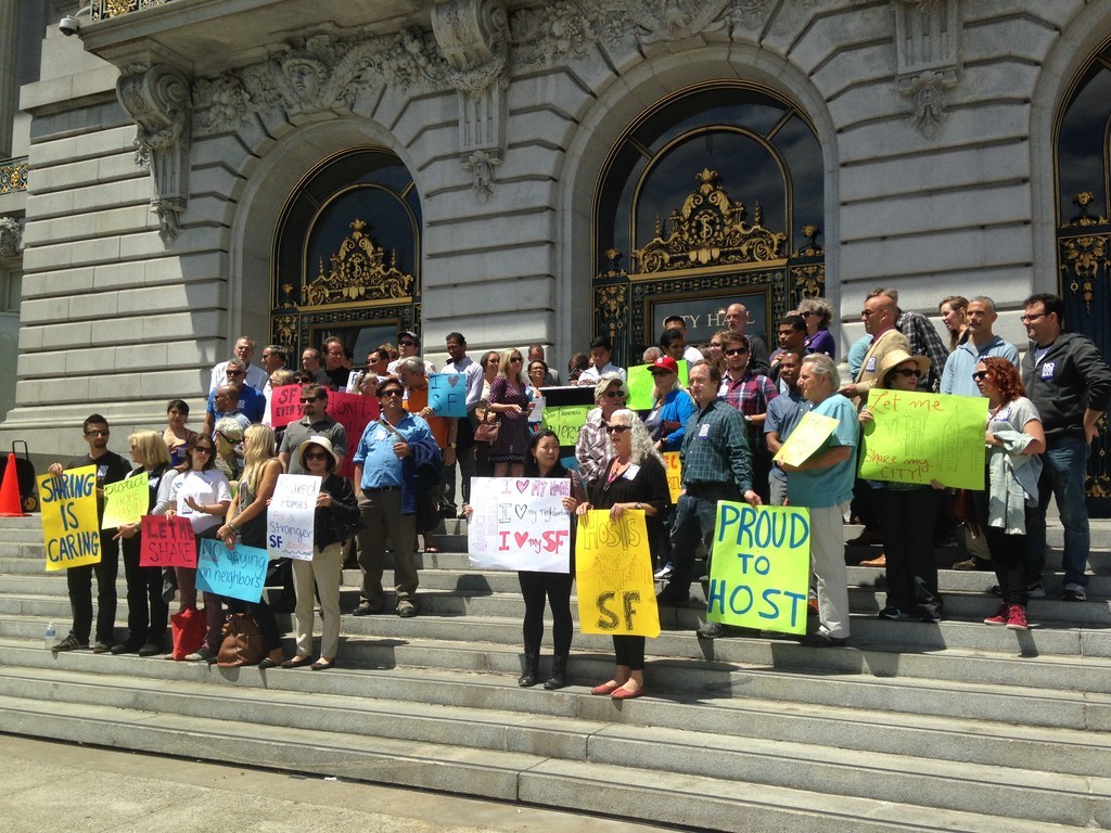 Members of the newly formed pro-home sharing campaign "SF for Everyone" speak out on the steps of San Francisco's City Hall.