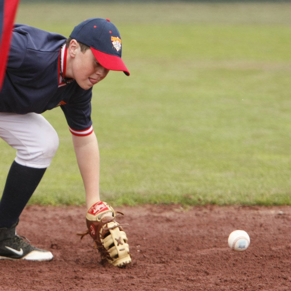 first baseman, Jake Durkin stop a ball from traveling that fell short to first base.