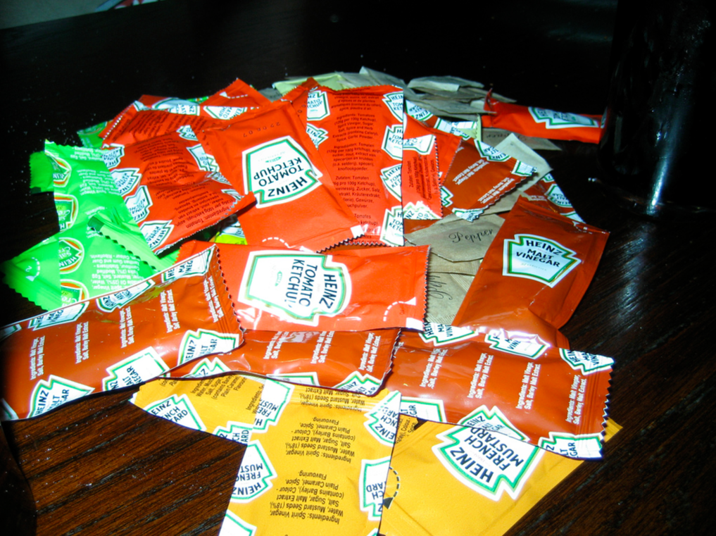 They used to have little packets in baskets that an enterprising student could stock their kitchen with all year. Now? They just have bottles. You can't take them anywhere. It's a disgrace.